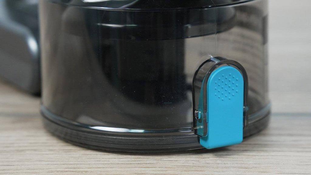 Teqqo Powerstick BASIC: Botón de vaciado del depósito de polvo